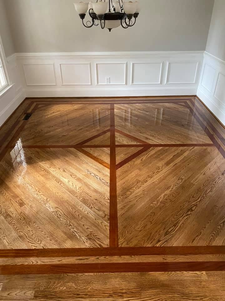 Brazilian cherry and white oak custom hardwood border inlay