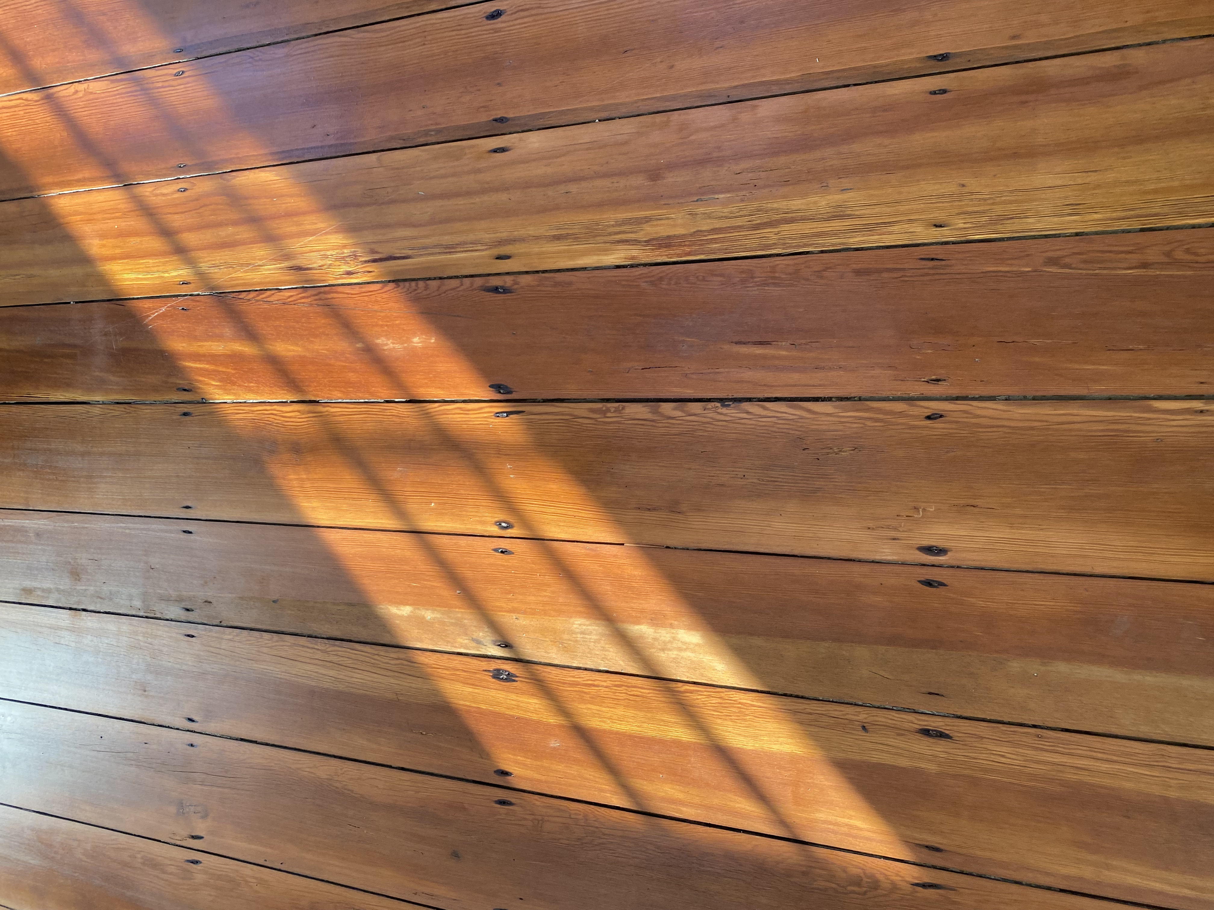 Detailed view of completed antique hardwood flooring