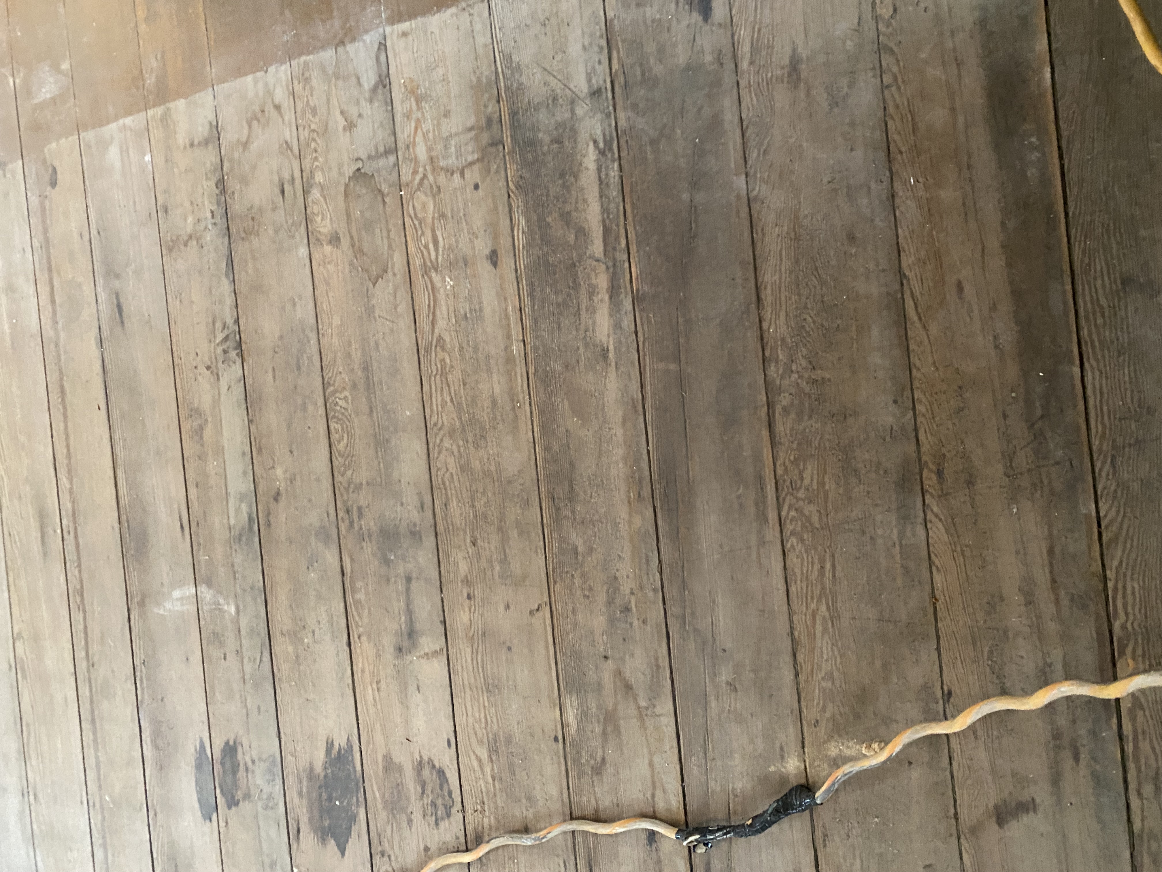 Antique hardwood flooring after sanding during restoration
