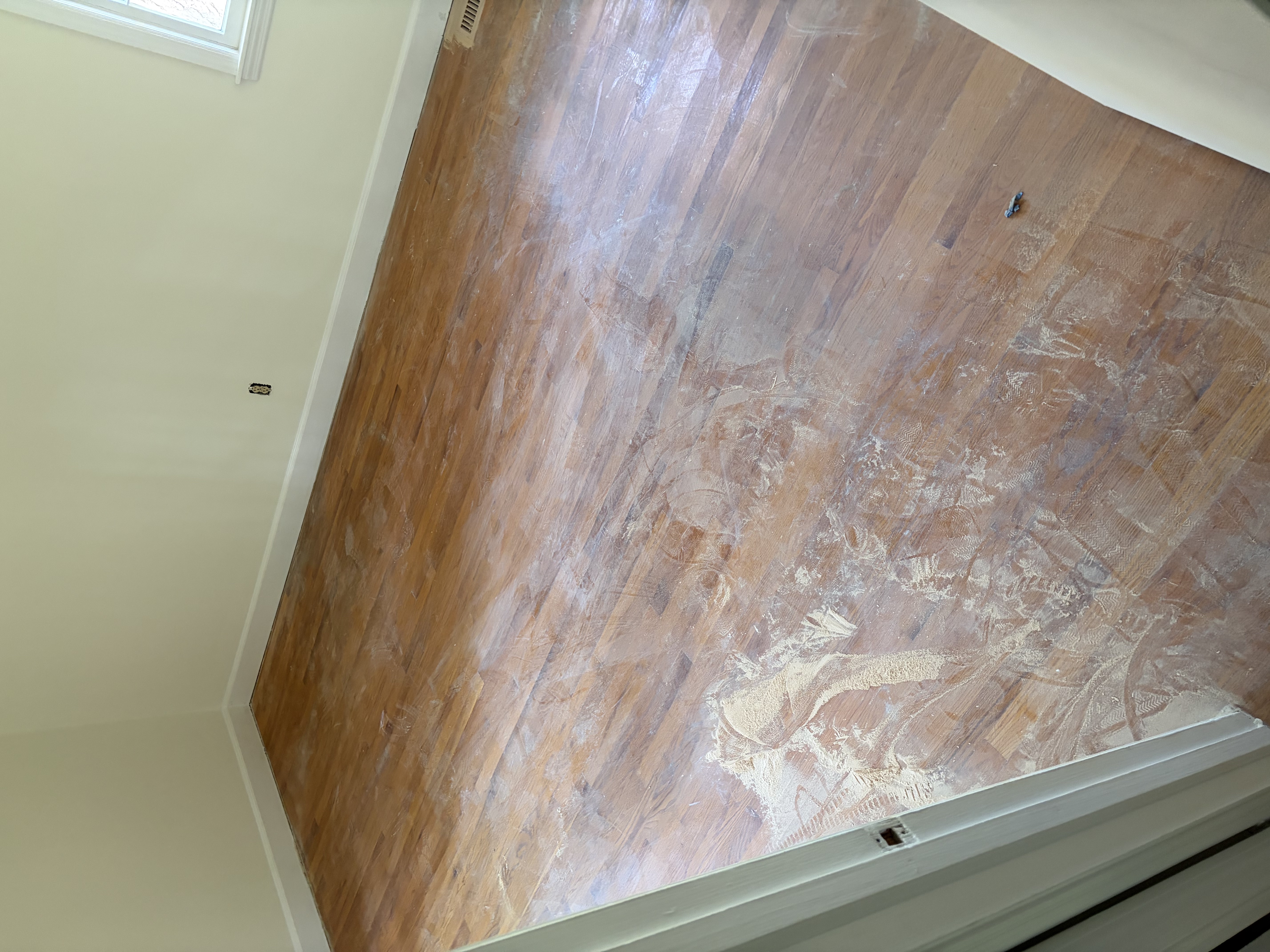 Worn oak hardwood floor before resanding