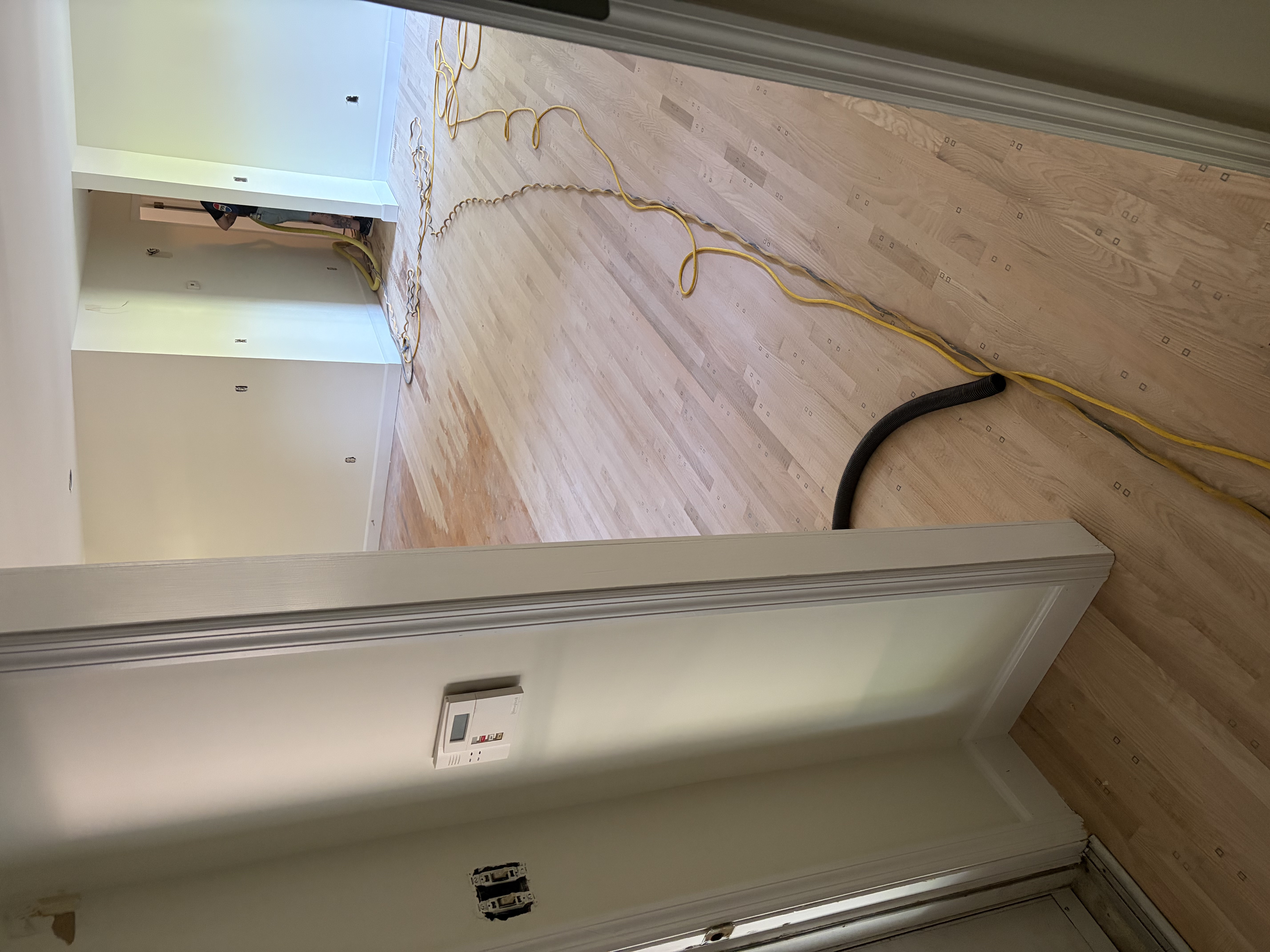 New oak boards installed and woven into the existing floor before resanding
