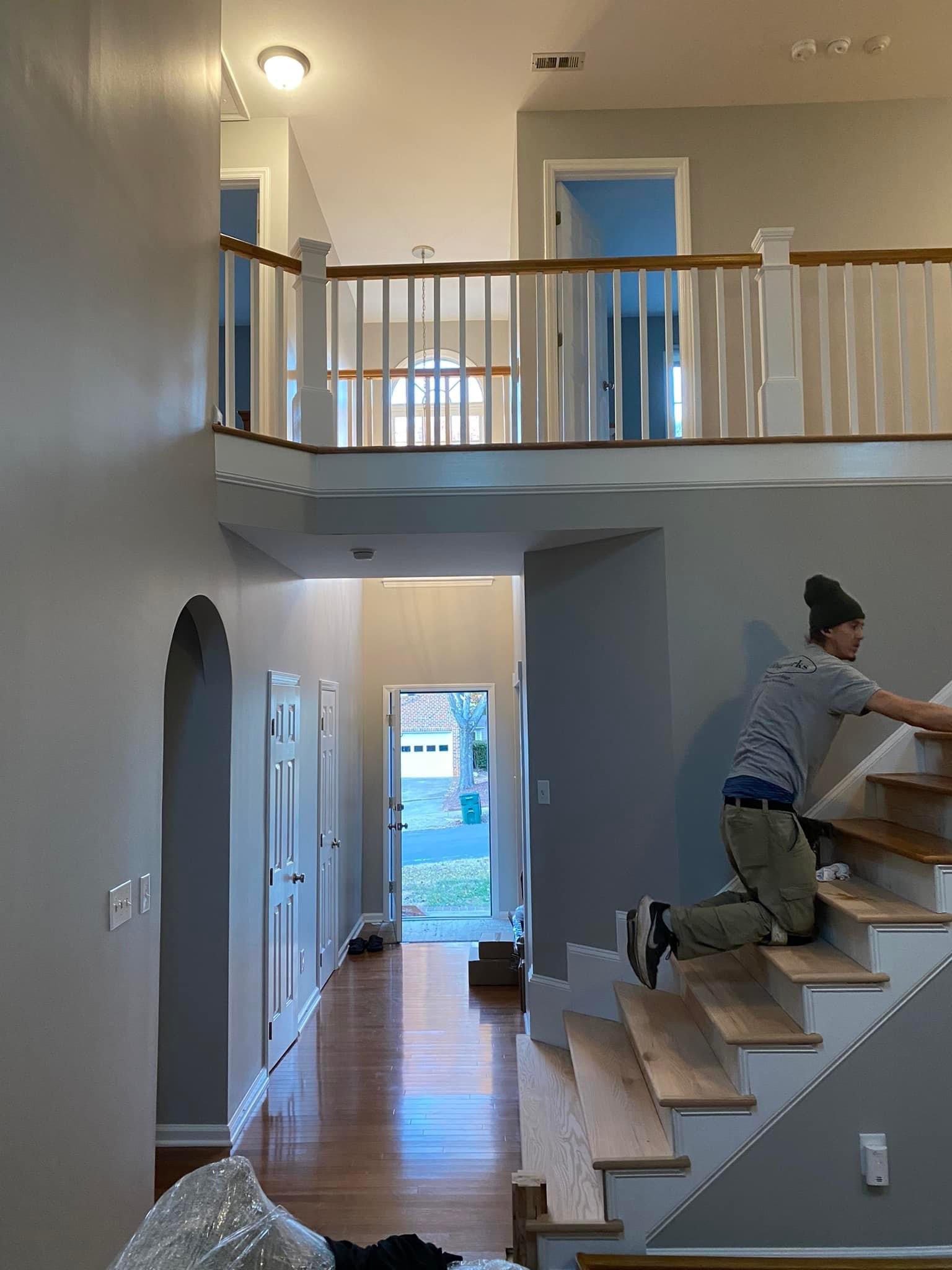 Stain being applied to newly installed oak stair treads
