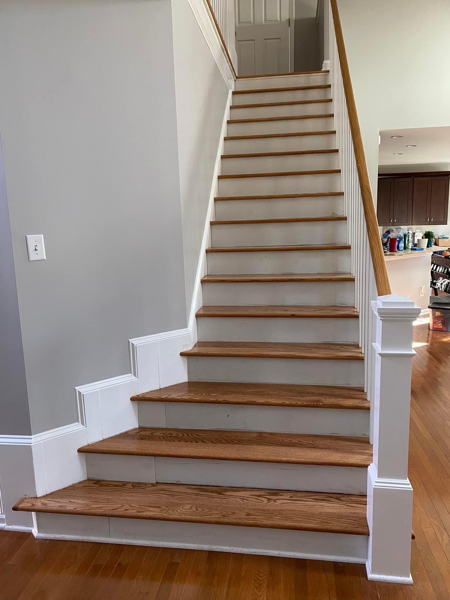 Completed oak staircase and banister viewed from the lower level