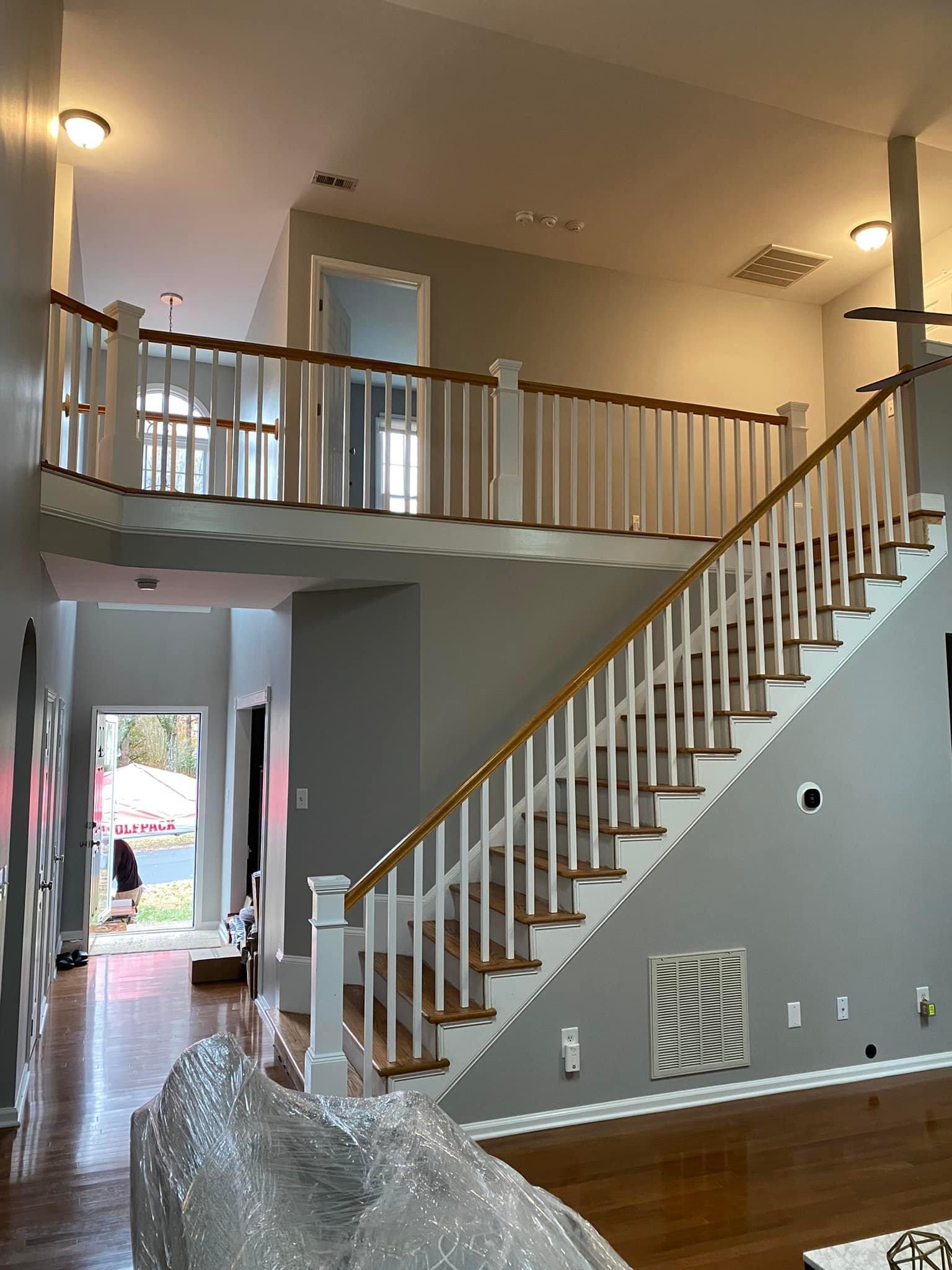 Completed oak staircase with new pickets and banisters viewed from the living room