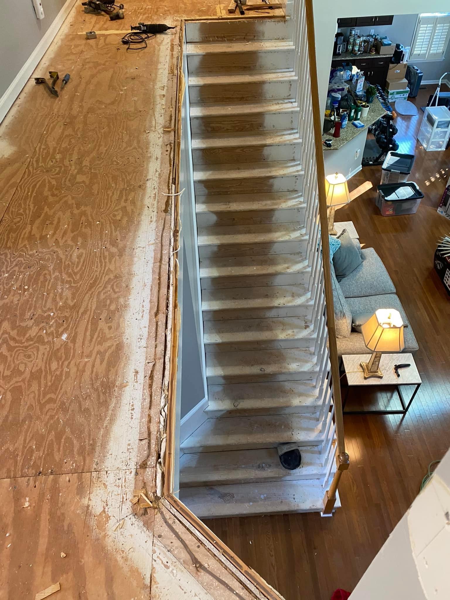 Upstairs hallway and stairs after carpet removal