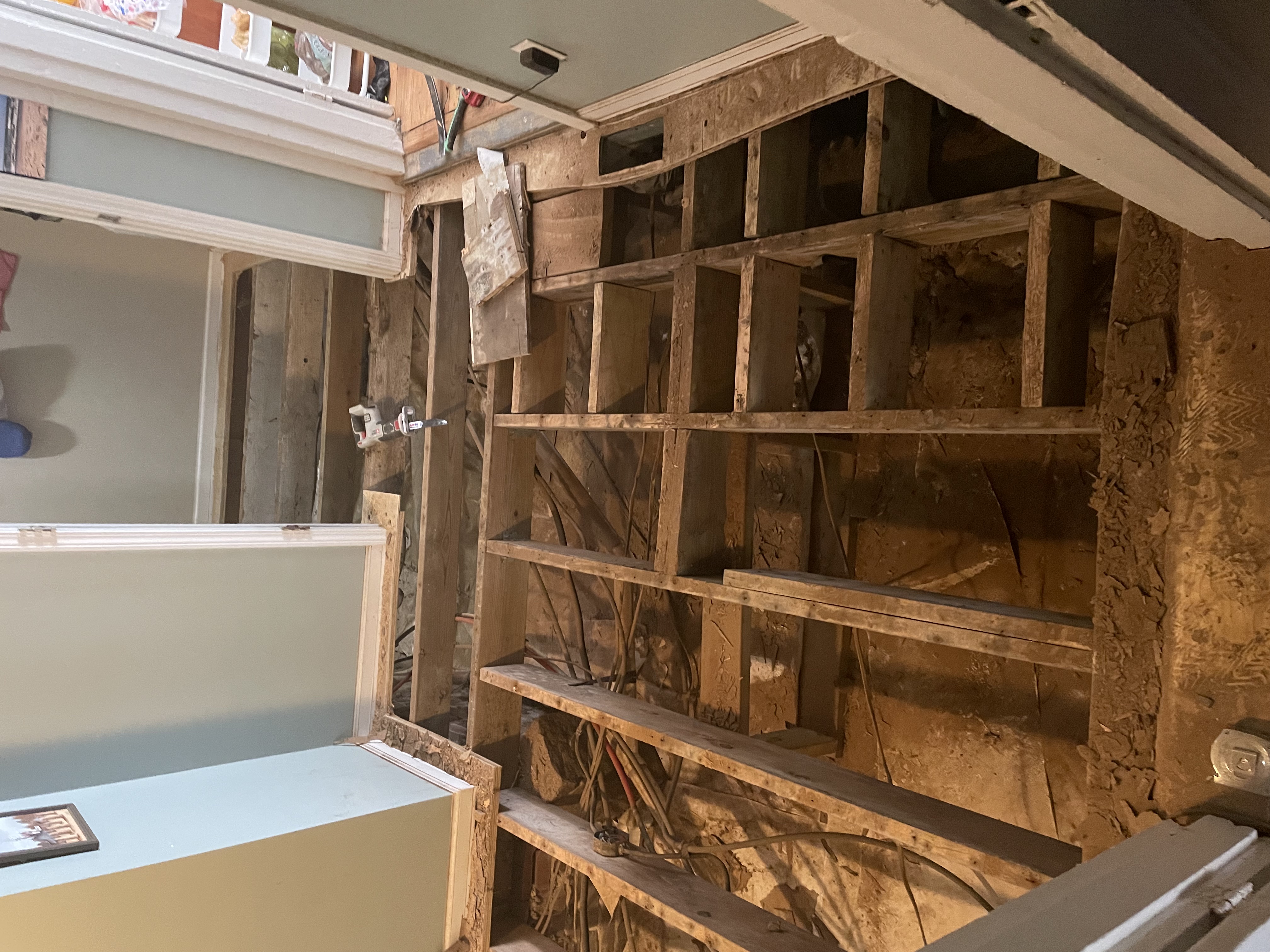 Rotted subfloor being replaced during a home renovation